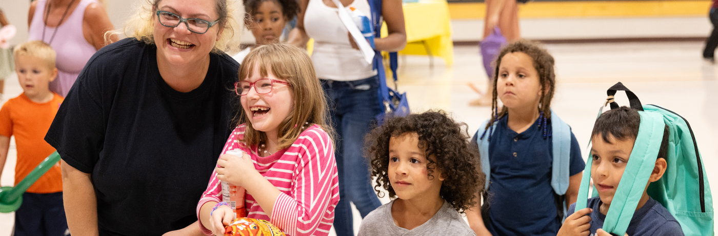 Students and families laughing