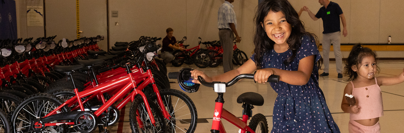 Student receiving new bike